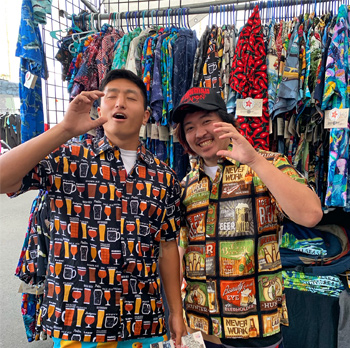 Japanese tourists wearing Beer Hawaiian Shirts at the Fiesta Hermosa Street Fair